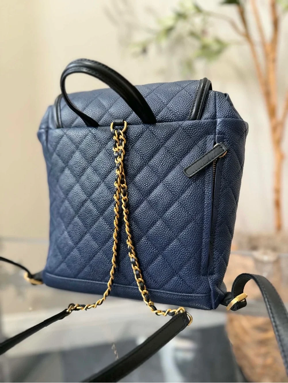 CHANEL Quilted Navy Caviar Leather Backpack with Gold Hardware